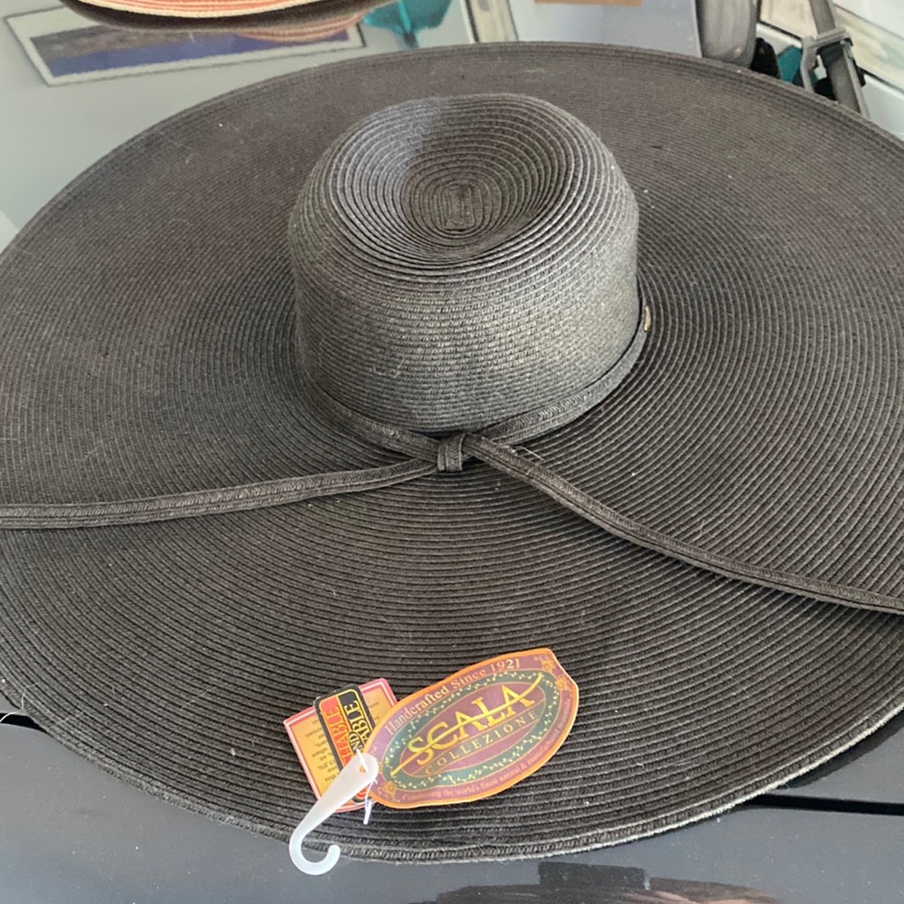Woman’s Scala black floppy hat one size fits all.